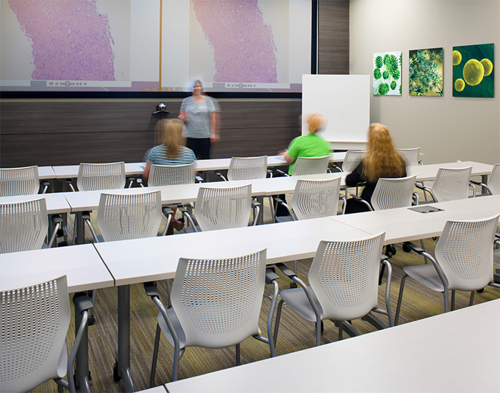 A training and classroom space invites staff and visitors to gather for lectures and discussion. Featured:MultiGeneration by Knoll<sup>®</sup> Stacking Chairs, Scribe<sup>®</sup> Mobile Markerboard